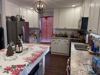 2115 Eastview Ave, Jefferson City, TN 37760 - kitchen with white cabinets, a notable chandelier, light stone countertops, and hanging light fixtures