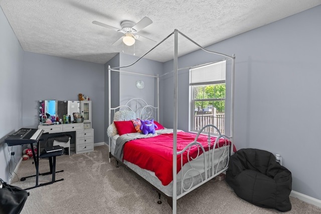 bedroom featuring carpet floors, a ceiling fan, a textured ceiling, and baseboards