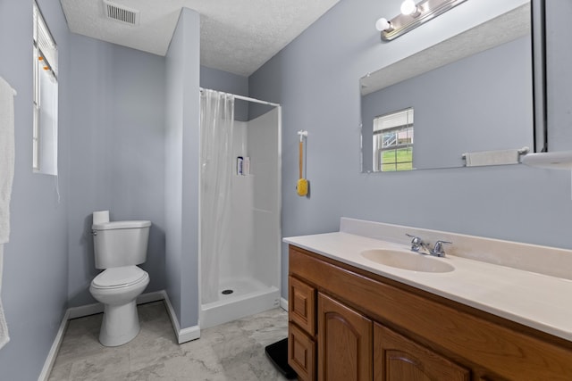 full bath featuring vanity, visible vents, toilet, baseboards, and a shower stall