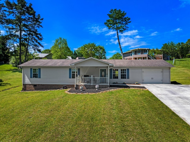 view of front facade with an attached garage, concrete driveway, a porch, and a front yard