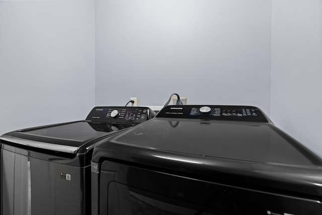 laundry area with laundry area and washing machine and dryer