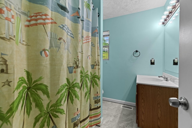 full bathroom with vanity, a textured ceiling, a shower with shower curtain, marble finish floor, and visible vents