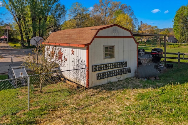 view of shed featuring fence