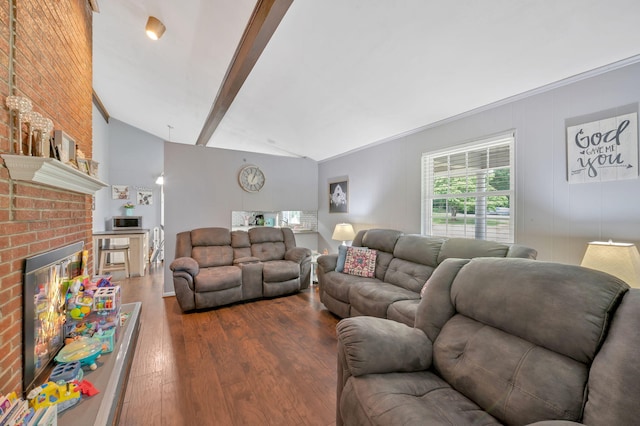 living room with vaulted ceiling with beams, a fireplace, and wood-type flooring