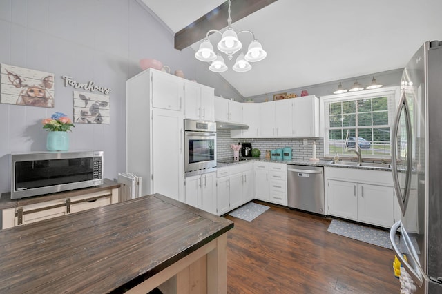 kitchen with high vaulted ceiling, white cabinets, dark hardwood / wood-style floors, beamed ceiling, and stainless steel appliances