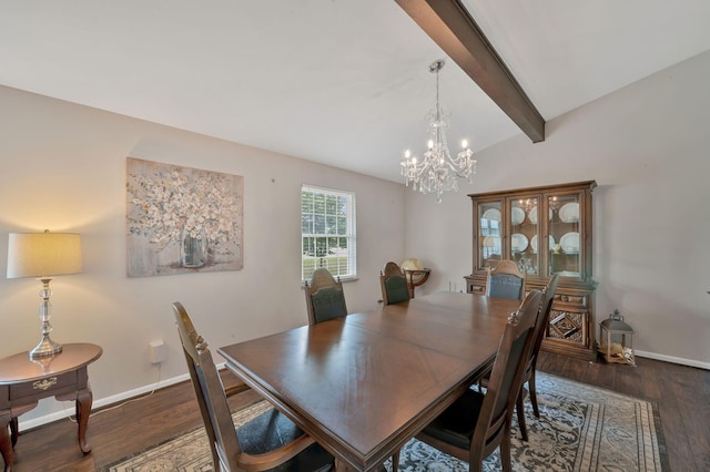 dining space featuring lofted ceiling with beams, an inviting chandelier, and dark wood-type flooring