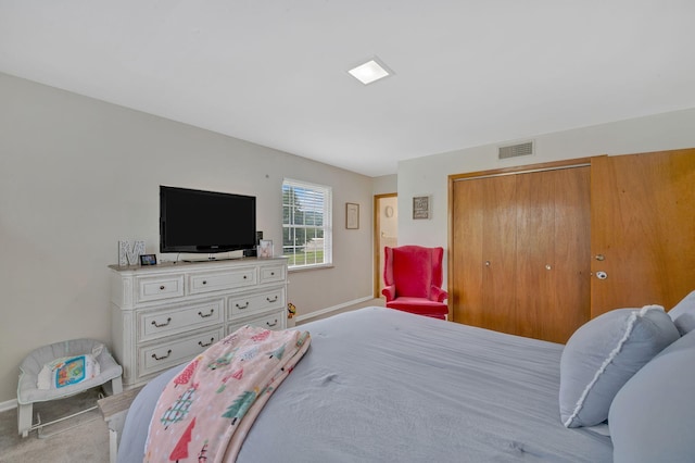 carpeted bedroom with a closet