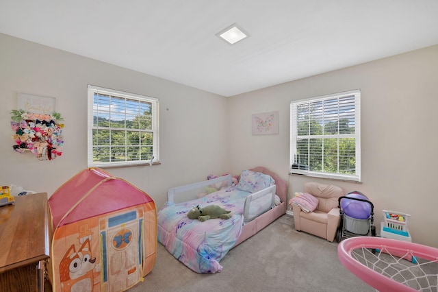 bedroom with light carpet