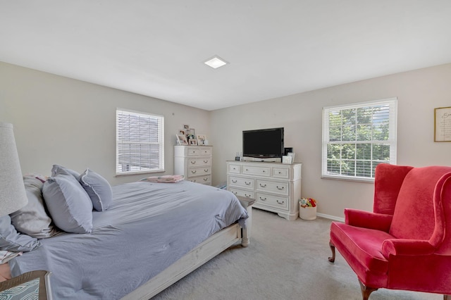 bedroom featuring light carpet