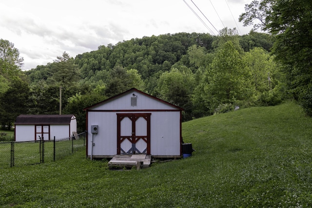 3084 Sherm Mountain Rd, Sneedville, TN 37869 - view of shed with a wooded view