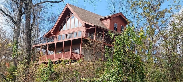 rear view of house with a balcony