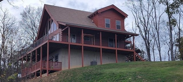 rear view of house with a yard