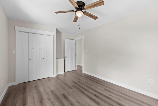126 Double Cave Rd, Rutledge, TN 37861 - unfurnished bedroom with wood finished floors, a closet, and a ceiling fan