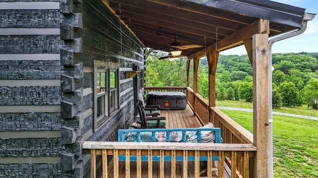 7868 Saint Clair Rd, Whitesburg, TN 37891 - wooden deck featuring a hot tub, a ceiling fan, a lawn, and a wooded view