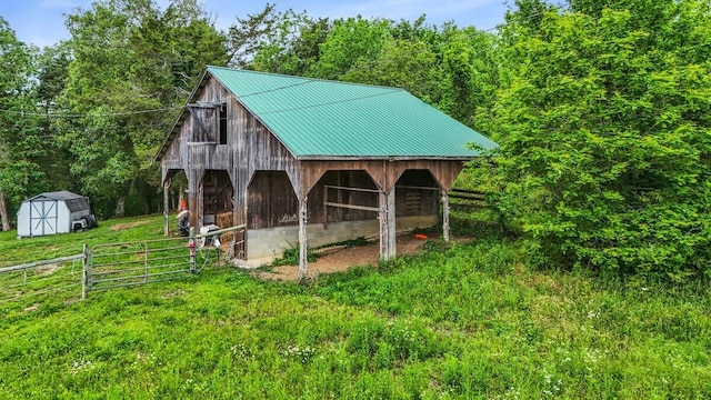 7868 Saint Clair Rd, Whitesburg, TN 37891 - view of shed featuring a view of trees