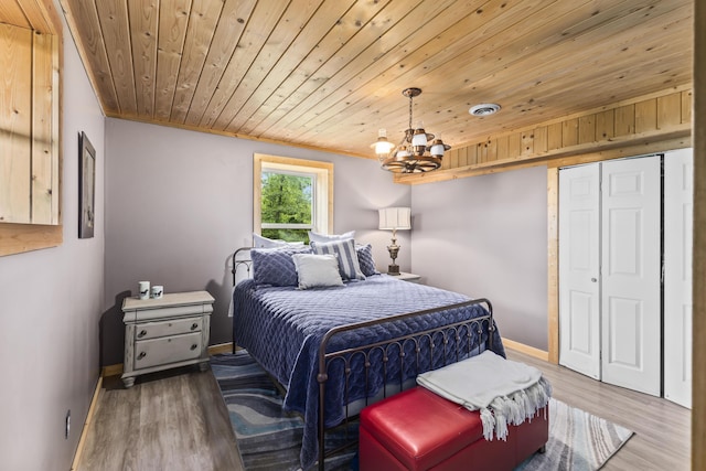 7868 Saint Clair Rd, Whitesburg, TN 37891 - bedroom featuring wooden ceiling, wood finished floors, a chandelier, baseboards, and a closet