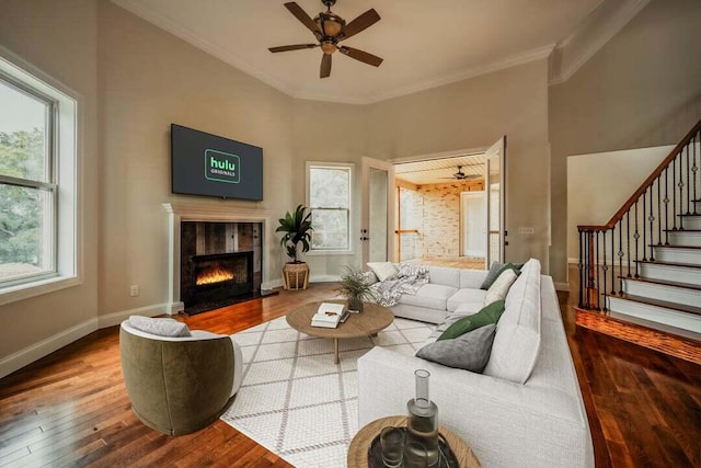 118 Luxury Ln, Dandridge, TN 37725 - living room with wood-type flooring, a fireplace, ornamental molding, ceiling fan, and baseboards
