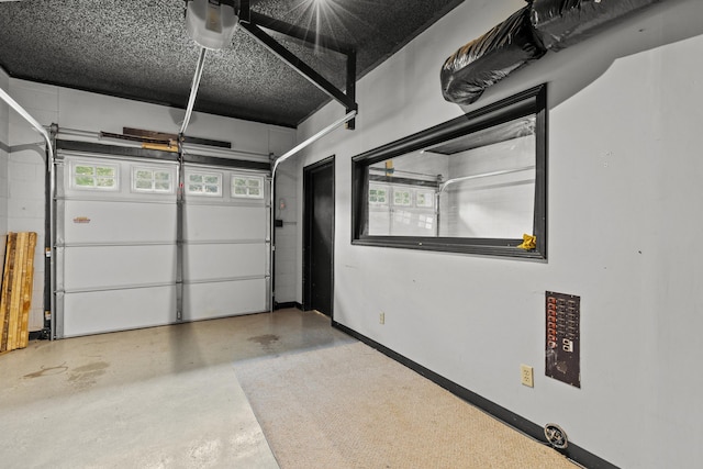 5715 Academy Dr, Morristown, TN 37814 - garage featuring a garage door opener and baseboards