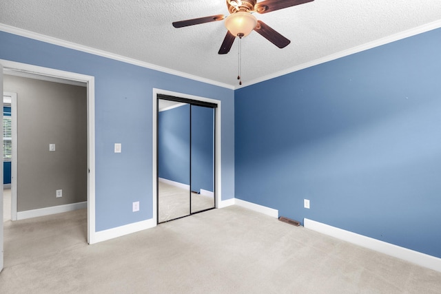 5715 Academy Dr, Morristown, TN 37814 - unfurnished bedroom with a textured ceiling, carpet floors, a closet, crown molding, and baseboards