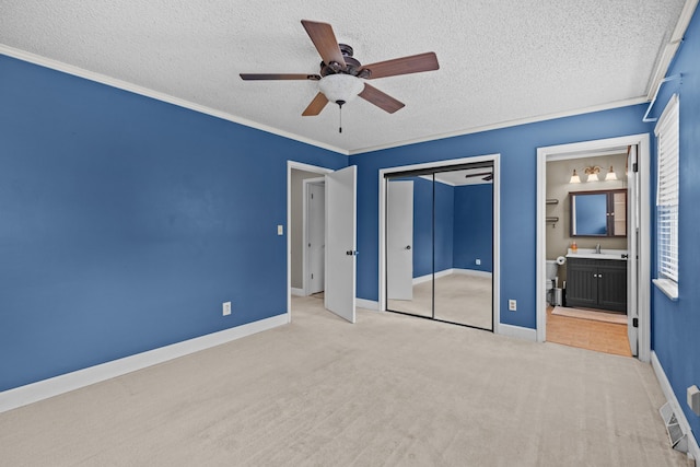 5715 Academy Dr, Morristown, TN 37814 - unfurnished bedroom featuring a sink, a textured ceiling, carpet, baseboards, and a closet