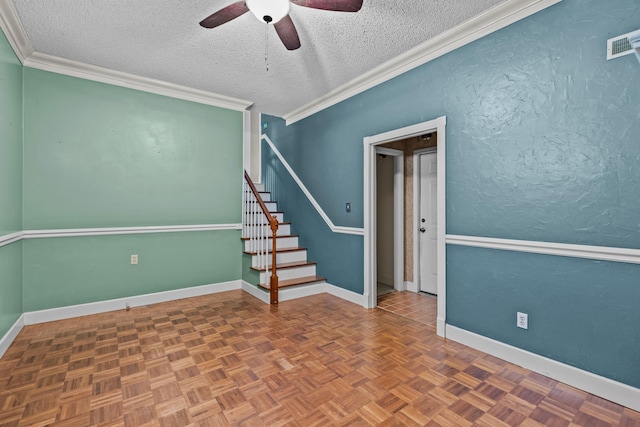 5715 Academy Dr, Morristown, TN 37814 - empty room featuring ceiling fan, a textured ceiling, stairs, baseboards, and crown molding