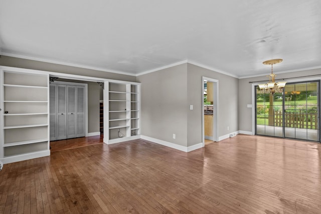 5715 Academy Dr, Morristown, TN 37814 - unfurnished living room with a chandelier, wood-type flooring, ornamental molding, and baseboards