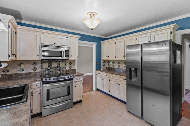 5715 Academy Dr, Morristown, TN 37814 - kitchen with appliances with stainless steel finishes, dark countertops, backsplash, a sink, and ornamental molding