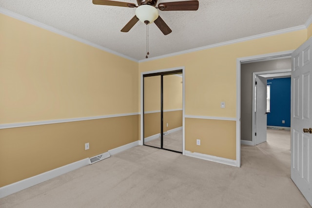 5715 Academy Dr, Morristown, TN 37814 - unfurnished bedroom with a textured ceiling, carpet floors, a closet, ornamental molding, and baseboards