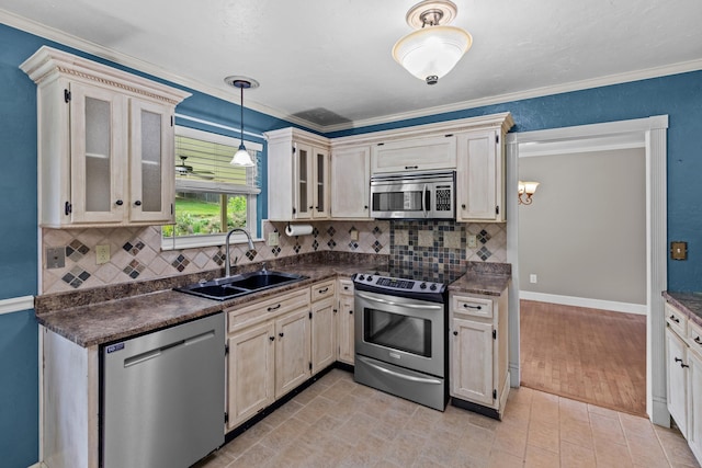 5715 Academy Dr, Morristown, TN 37814 - kitchen featuring stainless steel appliances, a sink, dark countertops, decorative backsplash, and glass insert cabinets