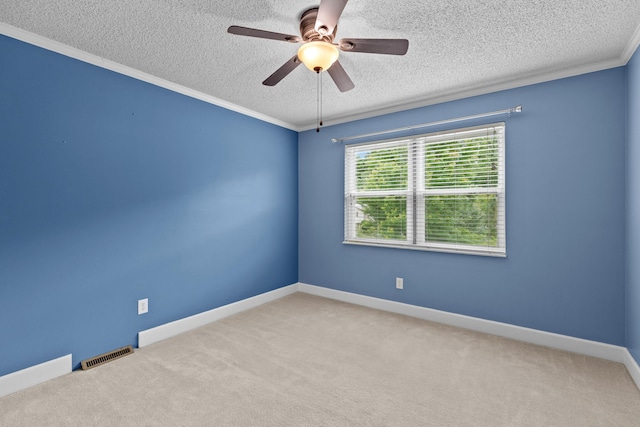 5715 Academy Dr, Morristown, TN 37814 - spare room featuring a textured ceiling, carpet floors, a ceiling fan, ornamental molding, and baseboards