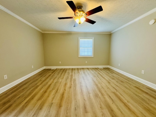 spare room with a textured ceiling, light hardwood / wood-style flooring, ceiling fan, and crown molding