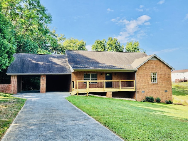 view of front facade featuring a carport and a front lawn