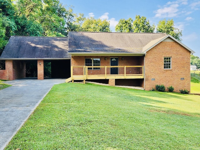 ranch-style home featuring a front lawn and a carport