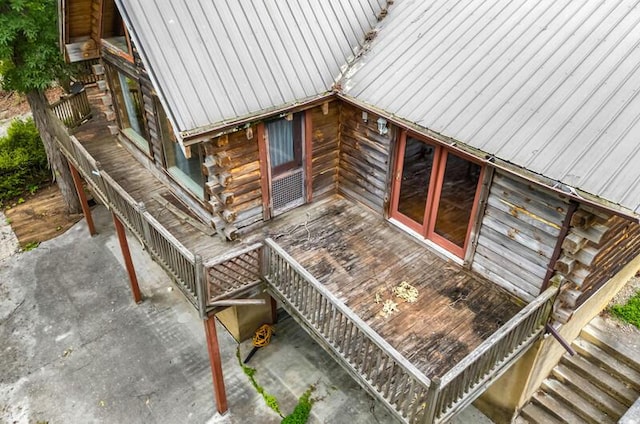 1370 Flat Woods Rd, Dandridge, TN 37725 - view of home's exterior with log exterior, stairs, and a metal roof
