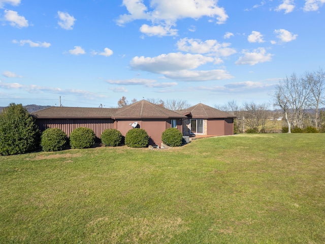 view of property exterior featuring a lawn