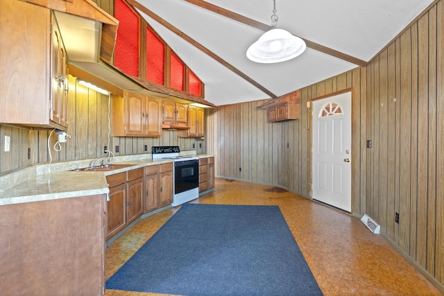 kitchen featuring sink, vaulted ceiling with beams, pendant lighting, wooden walls, and range with electric cooktop