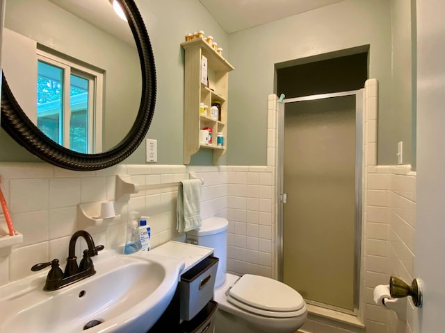 1578 Golf Course Rd, Newport, TN 37821 - full bathroom with a sink, tile walls, toilet, a shower stall, and wainscoting