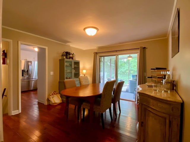 1578 Golf Course Rd, Newport, TN 37821 - dining area with dark wood-style floors, crown molding, and baseboards