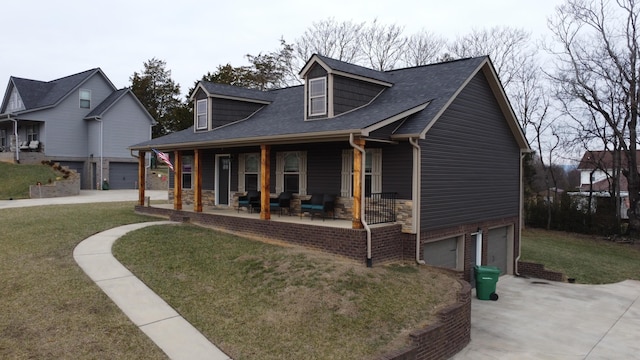 cape cod-style house with a porch, a garage, and a front yard