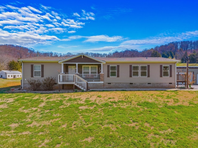 2115 Rambling Rose Ln, Jefferson City, TN 37760 - view of front facade featuring covered porch, a front lawn, and crawl space