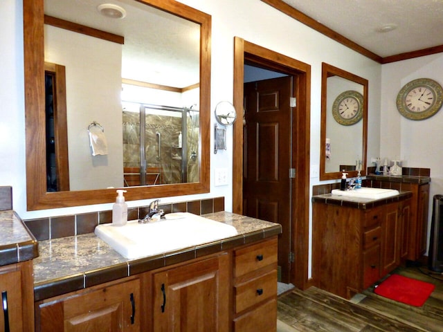 2115 Rambling Rose Ln, Jefferson City, TN 37760 - full bath featuring wood finished floors, vanity, ornamental molding, and a shower stall
