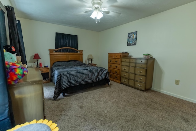 bedroom featuring ceiling fan and light carpet