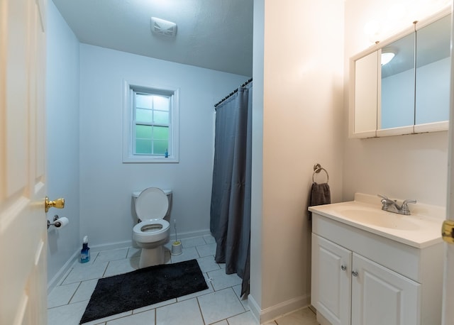 bathroom with tile patterned flooring, a shower with curtain, vanity, and toilet