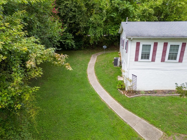 view of yard with central AC