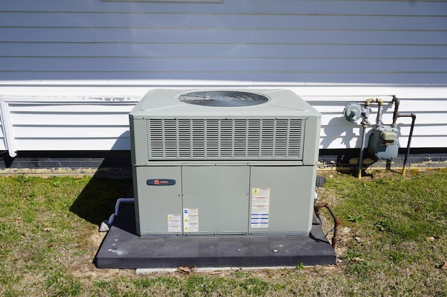 exterior details featuring gas meter and central AC