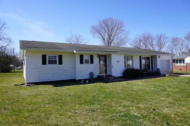 view of front facade with an attached garage and a front lawn