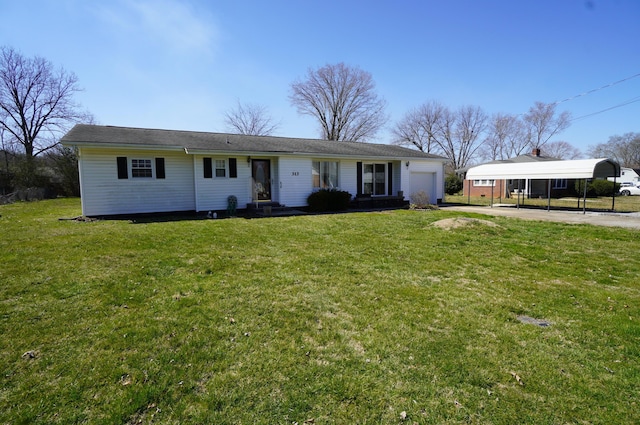 single story home with a carport, driveway, an attached garage, and a front lawn