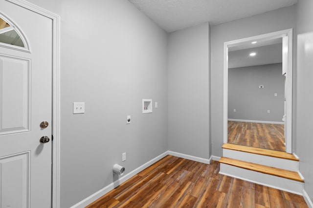 laundry room featuring laundry area, baseboards, wood finished floors, hookup for a washing machine, and electric dryer hookup