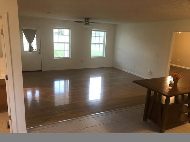 unfurnished room featuring ceiling fan and light hardwood / wood-style flooring