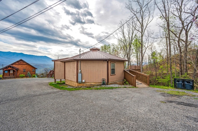 view of outbuilding featuring a mountain view